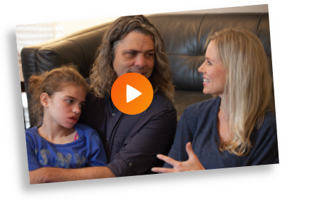 Riley and family on the couch Watch a video about the story that inspired Unspoken Symphony